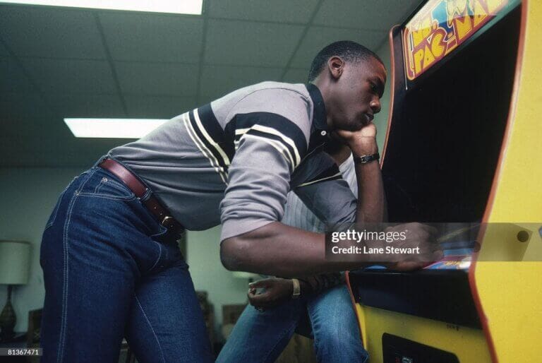 UNC Michael Jordan UNITED STATES - NOVEMBER 11: College Basketball: Casual portrait of North Carolina Michael Jordan playing MS, PACMAN video arcade game at University of North Carolina, Chapel Hill, NC 11/11/1983 (Photo by Lane Stewart/Sports Illustrated via Getty Images/Getty Images) (SetNumber: X29265)