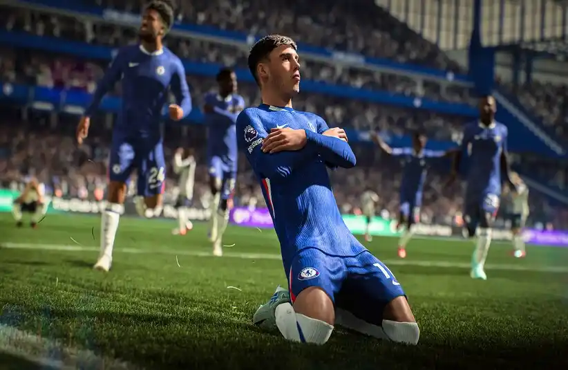 EA Sports FC 26 player in blue uniform celebrating