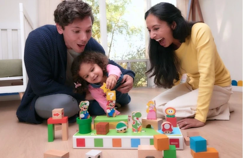 Image of a family playing with the My Mario toys.